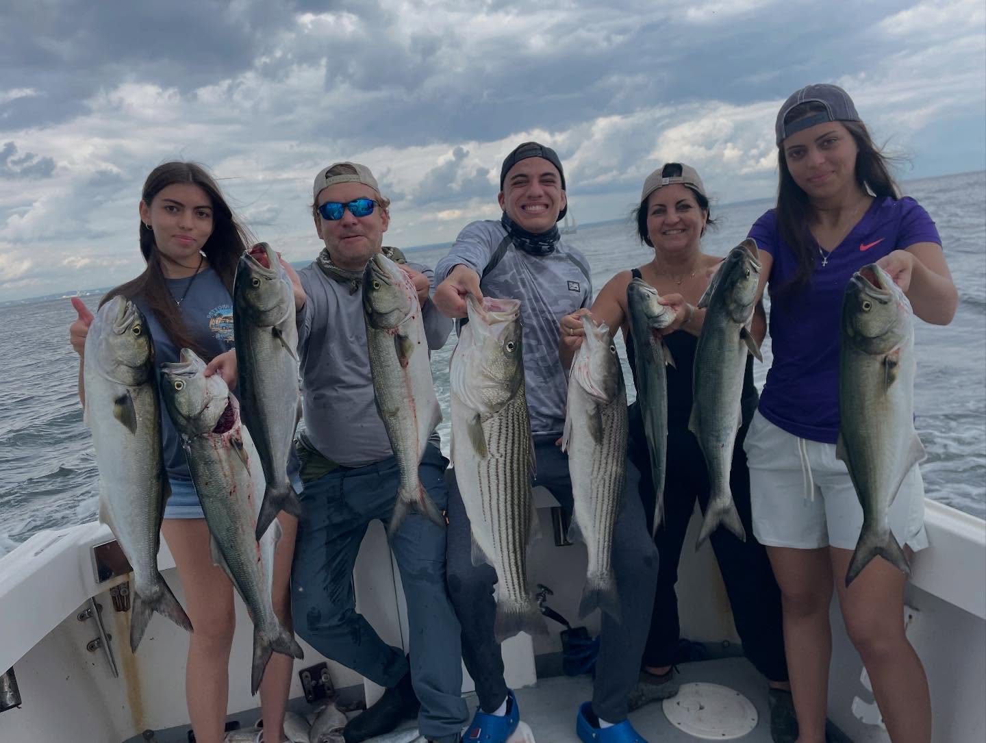 Large group of anglers with striped bass after a Long Island Sound charter