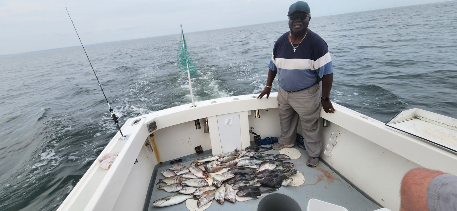 Angler fishing from the stern of the Christina M II on the Long Island Sound