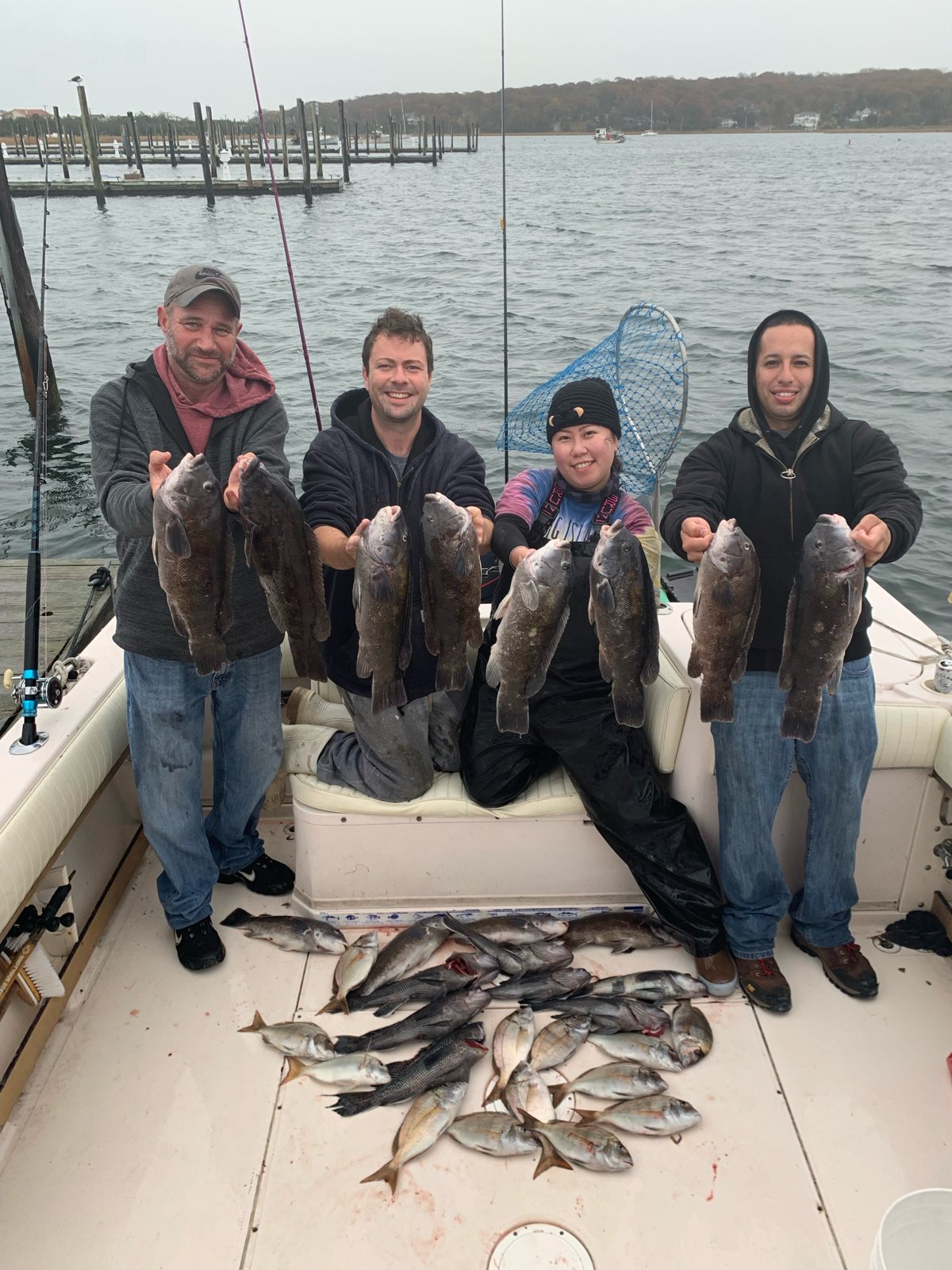 Group of anglers with a big haul of blackfish on a fall charter