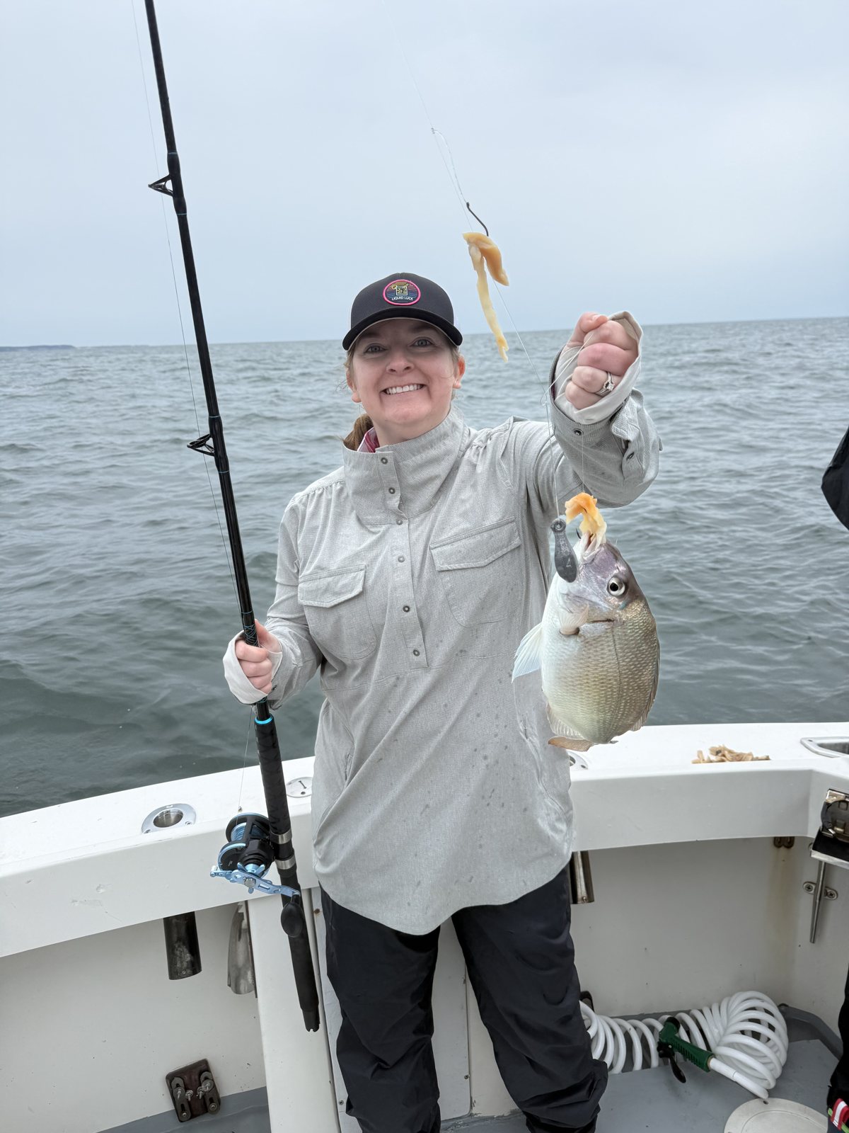 Angler holding a porgy caught on the Long Island Sound
